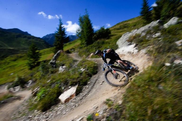 Electric bike taking a sharp bank on the Swiss Epic 2020