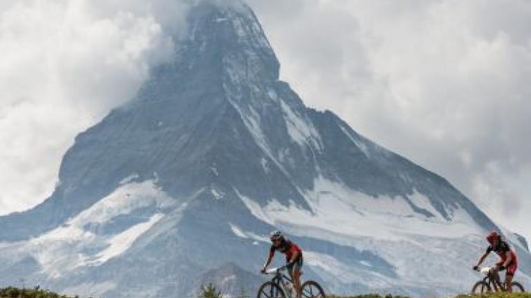 Mountain shot with bikers in front [Swiss Epic]